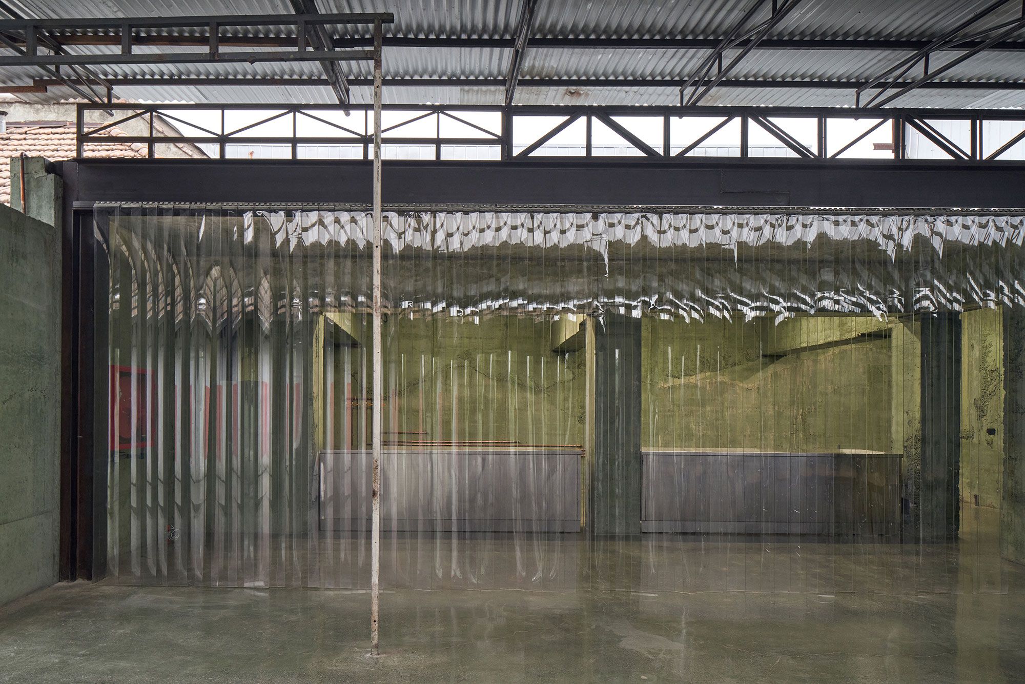 PVC curtains that set off the bar without closing the space.
