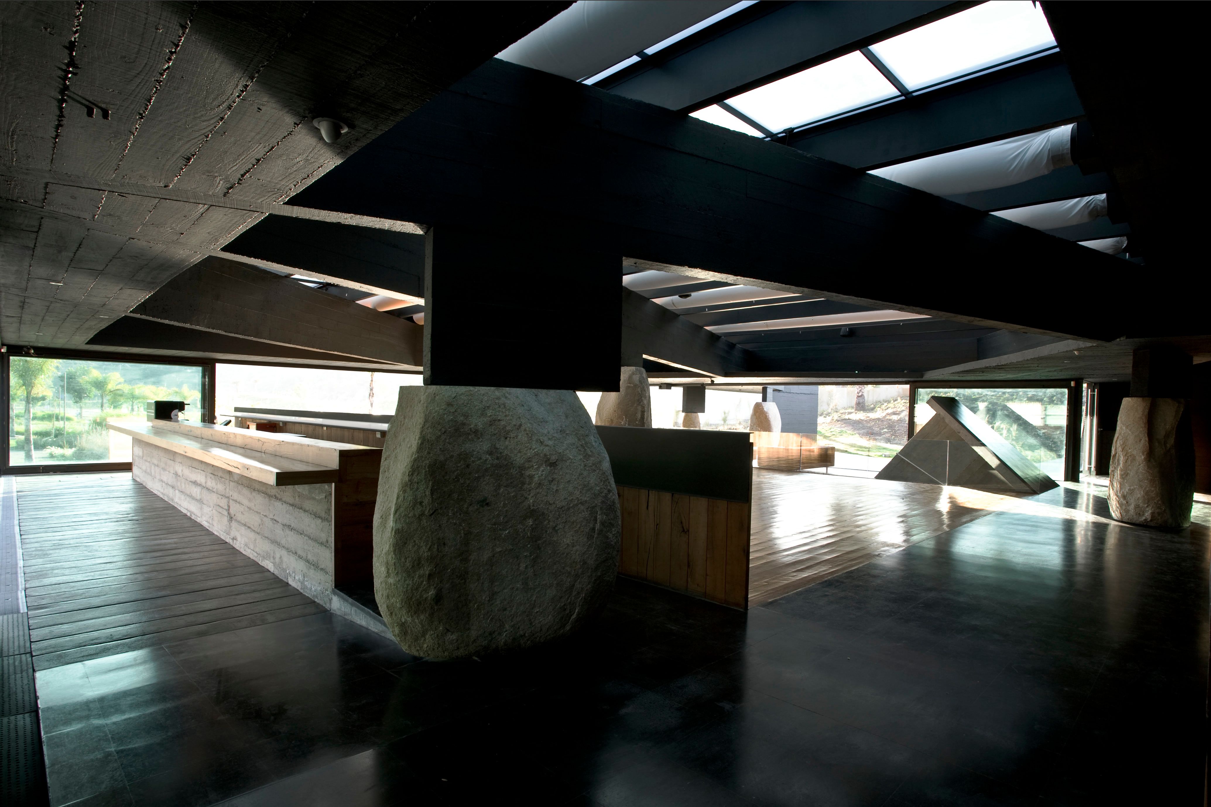 The bar. Concrete, timber and a boulder holding up the beam.
